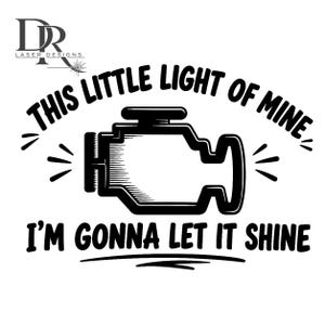 May include: A black graphic design featuring a stylised engine icon in the centre. The text "THIS LITTLE LIGHT OF MINE" is arched above the engine, and "I'M GONNA LET IT SHINE" is printed below. Small radiating lines surround the engine icon.