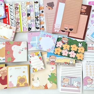 May include: An assortment of colourful sticky notes featuring cute animal illustrations, including bears, bunnies, and birds. The notes are perfect for adding a touch of whimsy to your planner, journal, or desk. Some notes have a daily or 20-day challenge theme.
