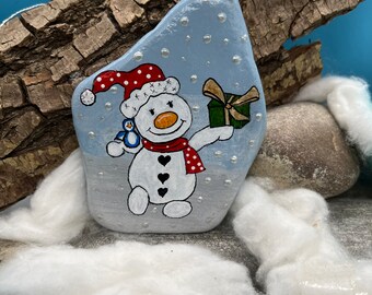Christmas snowman with hat, gift and penguin "Pebble Art" hand painted on a natural stone.