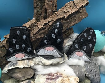 The "Happy Skull Christmas gnome gang, 3 pieces in black silvery robes, handmade unique pieces immortalized on a natural stone