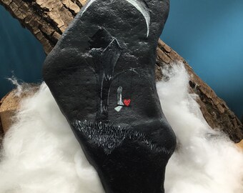 The tree eater and the lonely girl on the swing, hand-painted unique piece, immortalized on a large, characterful natural stone.