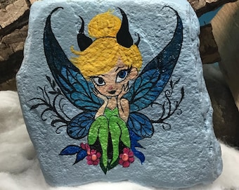 An enchanting elf, painted and immortalized on a natural stone.