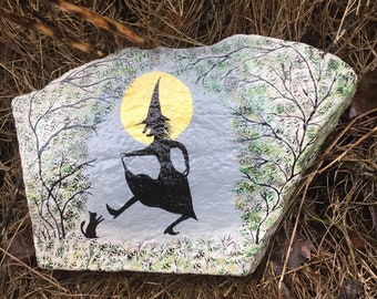 Witch dance in the moonlight with cat in the forest, hand-painted on a large panoramic natural stone.
