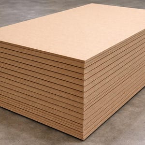 May include: A stack of rectangular, light brown wooden boards. The boards are neatly arranged, forming a compact rectangular shape. The edges of the boards are visible, creating a layered effect. The wood has a natural, unfinished appearance.