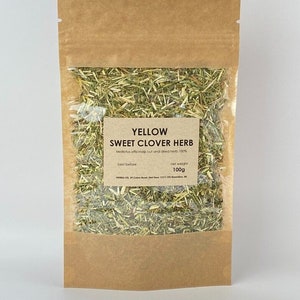 May include: A brown paper pouch with a clear plastic window showing yellow sweet clover herb inside. The label reads "YELLOW SWEET CLOVER HERB" and "Melilotus officinalis cut and dried herb 100%". The net weight is 100g.