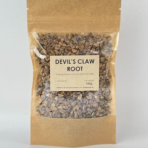 May include: A brown paper pouch with a clear plastic window, containing dried Devil's Claw Root. The label reads "Devil's Claw Root, Harpagophytum cut and dried root 100%, net weight 100g".