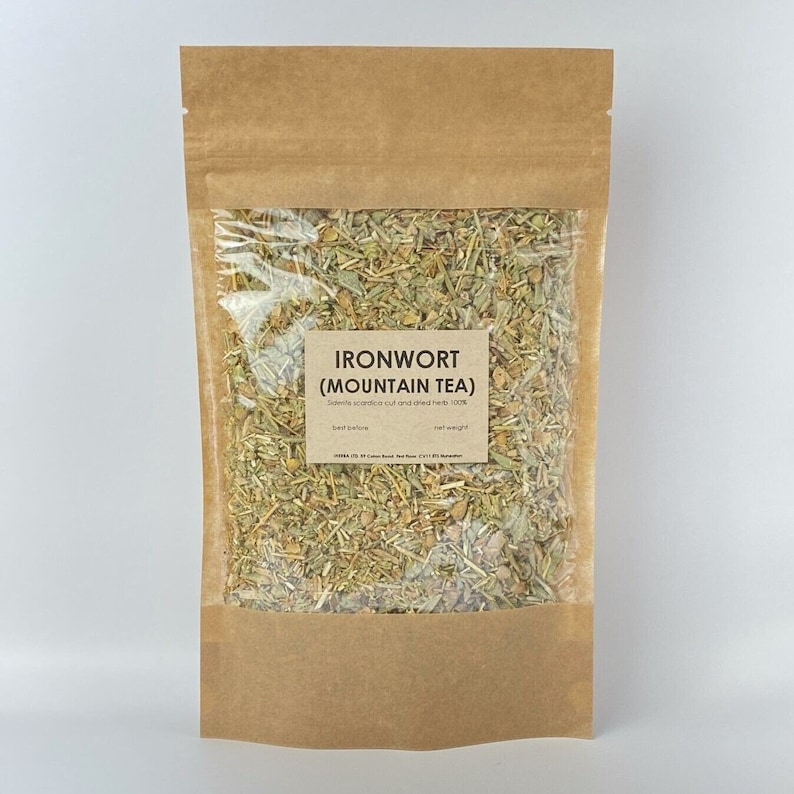 May include: A brown paper bag with a clear plastic window, containing dried herbs labeled "IRONWORT (MOUNTAIN TEA)". The label also states "Sideeta scardico cut and dried herb 100%".