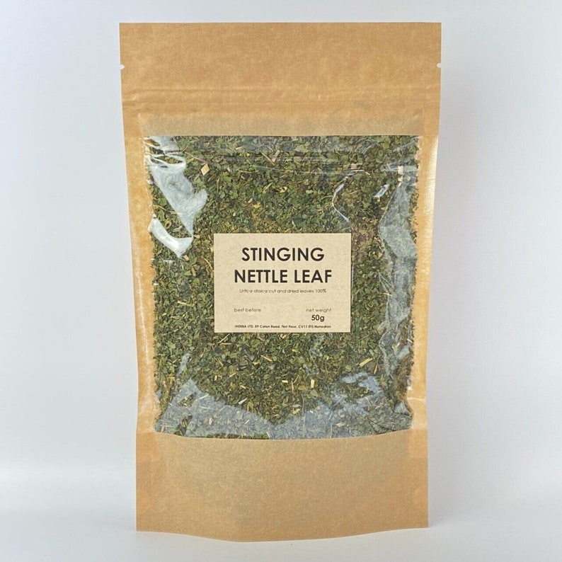 May include: A brown paper bag with a clear window, filled with dried stinging nettle leaf. The label reads "Stinging Nettle Leaf" with the net weight of 50g. The bag is sealed and ready for use.