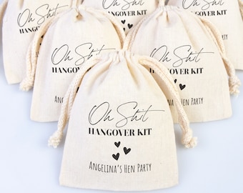 May include: A set of small white cotton drawstring bags with the text "Oh Shit Hangover Kit" printed on them. The bags are decorated with small black hearts and the name "Angelina's Hen Party".