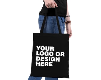 May include: A black tote bag with white text that reads "YOUR LOGO OR DESIGN HERE".