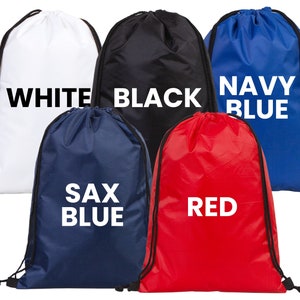 May include: Five drawstring bags in white, black, navy blue, sax blue, and red. Each bag has a matching drawstring closure and the color name printed in large white letters on the front.
