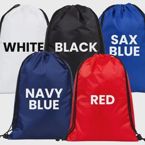 May include: Five drawstring bags in white, black, sax blue, navy blue, and red. Each bag features black drawstrings and white text printed on the front identifying its color: WHITE, BLACK, SAX BLUE, NAVY BLUE, and RED. The bags are arranged in two rows.