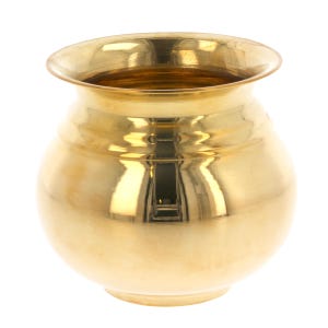 May include: A polished, gold-coloured metal pot with a rounded body and a flared rim. The pot has a smooth, reflective surface, and the interior is visible. The pot is likely used for decorative or ceremonial purposes.