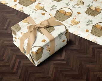 May include: A gift box wrapped in white paper with a brown ribbon. The paper has a repeating pattern of chickens, baskets of eggs, and brown speckled eggs.