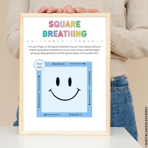 May include: A framed print with the words "SQUARE BREATHING" in colorful letters. The print features a blue square with a smiley face and arrows indicating breathing directions. Text explains the breathing exercise.