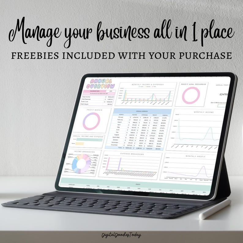 May include: A tablet with a keyboard case displays a business dashboard with charts and graphs. The screen shows financial data, including income, expenses, and profit goals. Text on the screen reads "Manage your business all in 1 place" and "FREEBIES INCLUDED WITH YOUR PURCHASE."