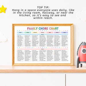 May include: A framed family chore chart with a wooden frame. The chart lists daily and weekly tasks, with headings for each day of the week. The text at the top says, "Hang in a space everyone uses daily, like in the living room, hallway, or near the kitchen."