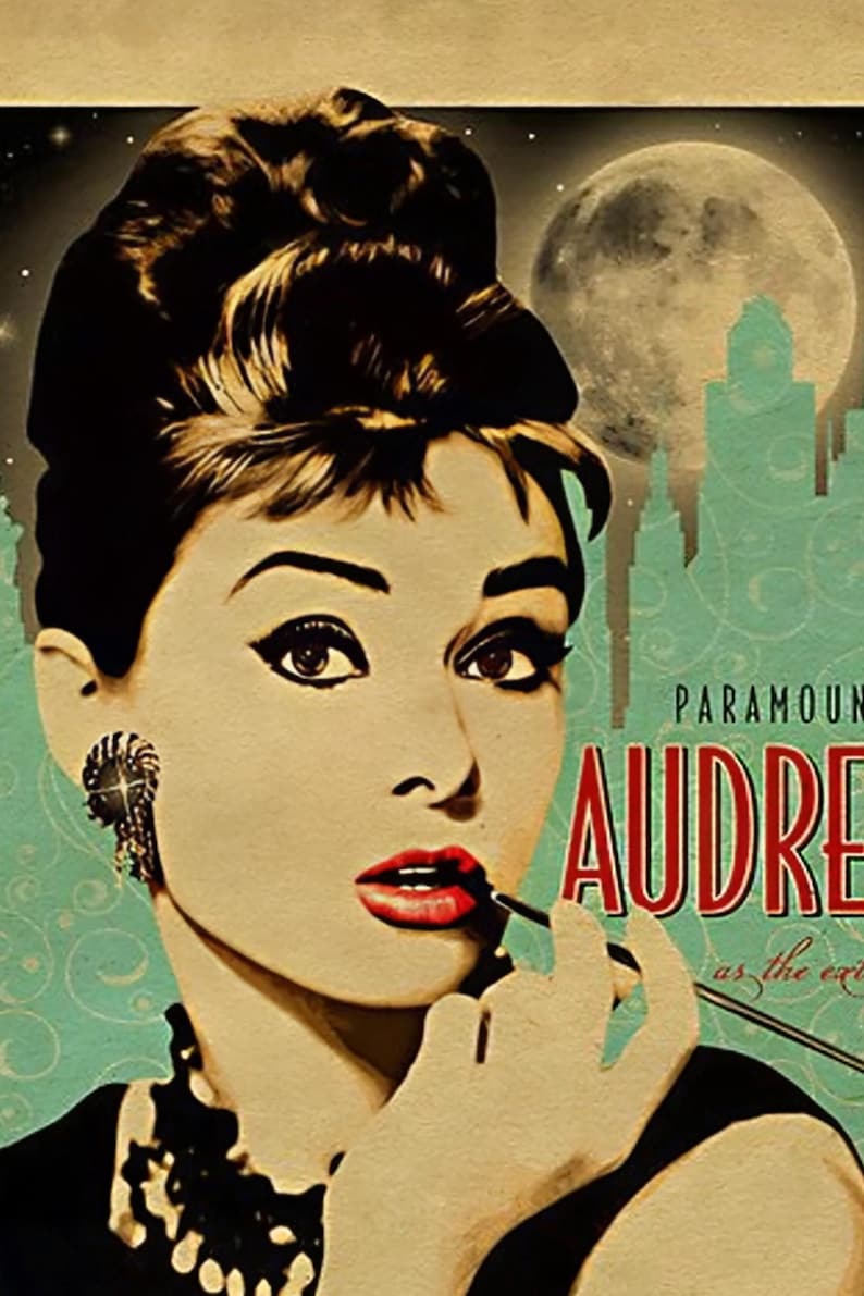 May include: Vintage-style poster featuring Audrey Hepburn applying lipstick. The image has a retro aesthetic with a teal background, a full moon, and a city skyline. The text "PARAMOUNT AUDREY" is displayed in red.