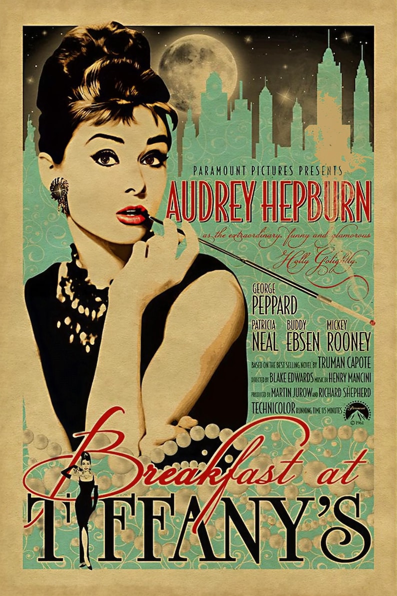 May include: Vintage movie poster for "Breakfast at Tiffany's" featuring Audrey Hepburn. The poster has a teal and tan color scheme with the film's title in large red letters. The poster includes the names of the cast and crew.