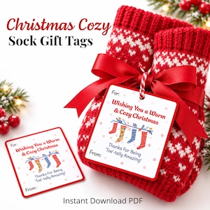 Christmas Cozy Sock Gift Tags printable shown attached to red knitted Christmas socks with a ribbon. Features colorful sock illustrations and the message “Wishing You a Warm & Cozy Christmas.” Instant download PDF for teacher, friend, and coworker gifts.