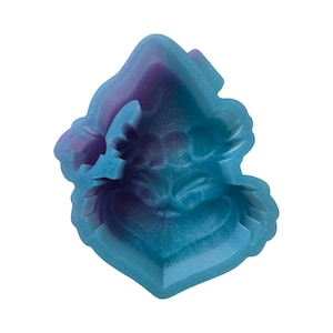 May include: A resin mold in shades of blue and purple, shaped like a heart with a face. The mold has a layered design with a textured surface, and is suitable for crafting projects.