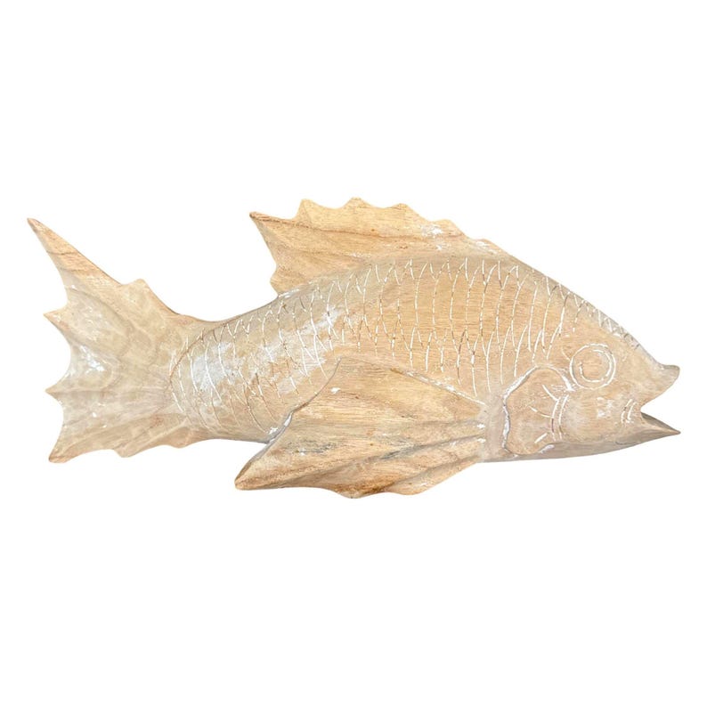 May include: A light brown wooden fish carving featuring visible grain patterns, etched scale details along the body, a prominent dorsal fin, and a wide, fanned tail. The surface has a natural, matte finish with carved lines defining the gills and eye.