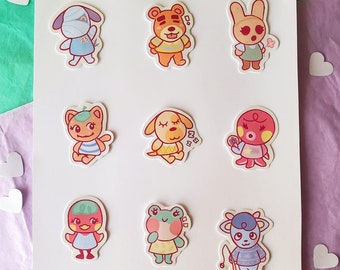 May include: A set of nine colorful animal character stickers. The stickers feature a variety of animal characters, including a dog, a cat, a frog, a bunny, a squirrel, an octopus, a sheep, a bear, and a wolf. The stickers are all in a cartoon style and have a variety of expressions.