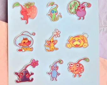 May include: Nine colorful stickers featuring characters from the video game series NiGHTS into Dreams. The stickers are on a light blue background.