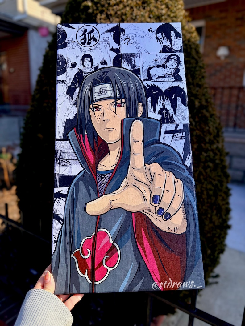 Op de afbeelding: Een canvas print met een manga-stijl illustratie van een personage met zwart haar en rode ogen. Het personage draagt een donkergrijze mantel met een rode voering en een rood wolk symbool. De achtergrond bevat manga panelen.