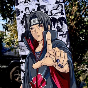 Op de afbeelding: Een canvas kunstwerk met een manga-stijl illustratie van een personage met zwart haar en rode ogen, wijzend. Het kunstwerk is overwegend zwart, wit, rood en grijs, met een wolk symbool en de tekst "@stdraws." zichtbaar.