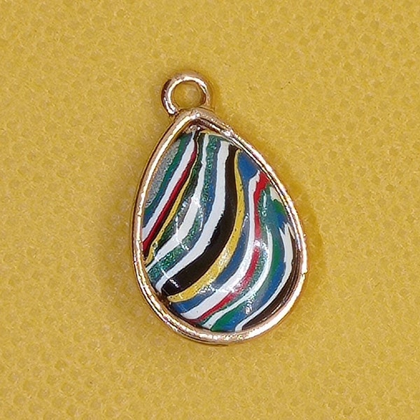 Handmade jewelry from artificial stone using Fordite technology.