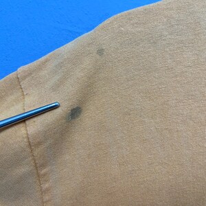 May include: A set of three ceramic mugs with a speckled, matte finish. The mugs are in shades of cream, light gray, and dark gray. Each mug has a simple, minimalist design, perfect for coffee or tea.