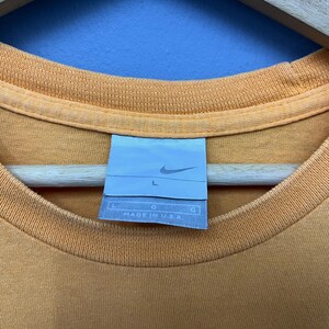 May include: A set of three ceramic mugs with a speckled, matte finish. The mugs are in shades of cream, light gray, and dark gray. Each mug has a simple, minimalist design, perfect for coffee or tea.