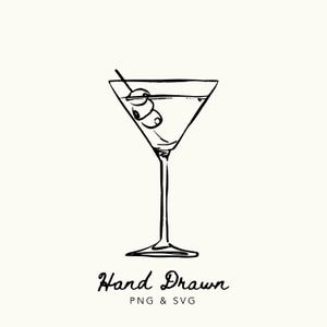 May include: Hand-drawn illustration of a martini in a classic triangular glass, garnished with olives on a toothpick. The image is in black and white, with the words "Hand Drawn" and "PNG & SVG" below the glass.