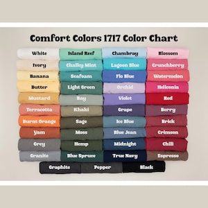 May include: A colour chart displaying 36 different shades of Comfort Colors 1717 fabric. The colours are arranged in rows of four, with each row representing a different colour family. The colour families are: White, Island Reef, Chambray, Blossom, Ivory, Chalky Mint, Lagoon Blue, Crunchberry, Banana, Seafoam, Flo Blue, Watermelon, Butter, Light Green, Orchid, Heliconia, Mustard, Bay, Violet, Red, Terracotta, Khaki, Grape, Berry, Burnt Orange, Sage, Ice Blue, Brick, Yam, Moss, Blue Jean, Crimson, Grey, Hemp, Midnight, Chili, Granite, Blue Spruce, True Navy, Espresso, Graphite, Pepper, Black.