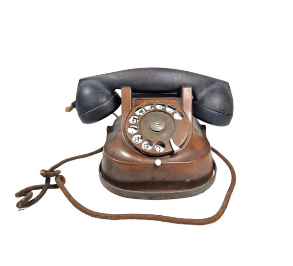 Antiguo teléfono fijo vintage dial rotativo con cable Mesa de