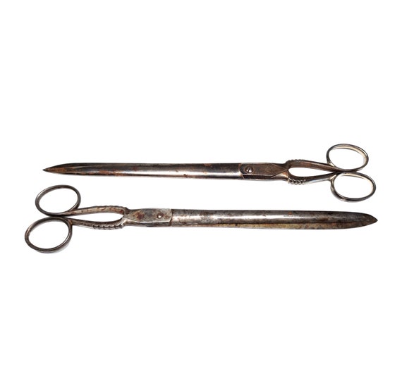 Small metal scissors. 5,25 inches long. Made in Taiwan.