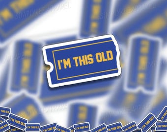 May include: A blue and yellow sticker with the text "I'm This Old" on it. The sticker is shaped like a ticket.