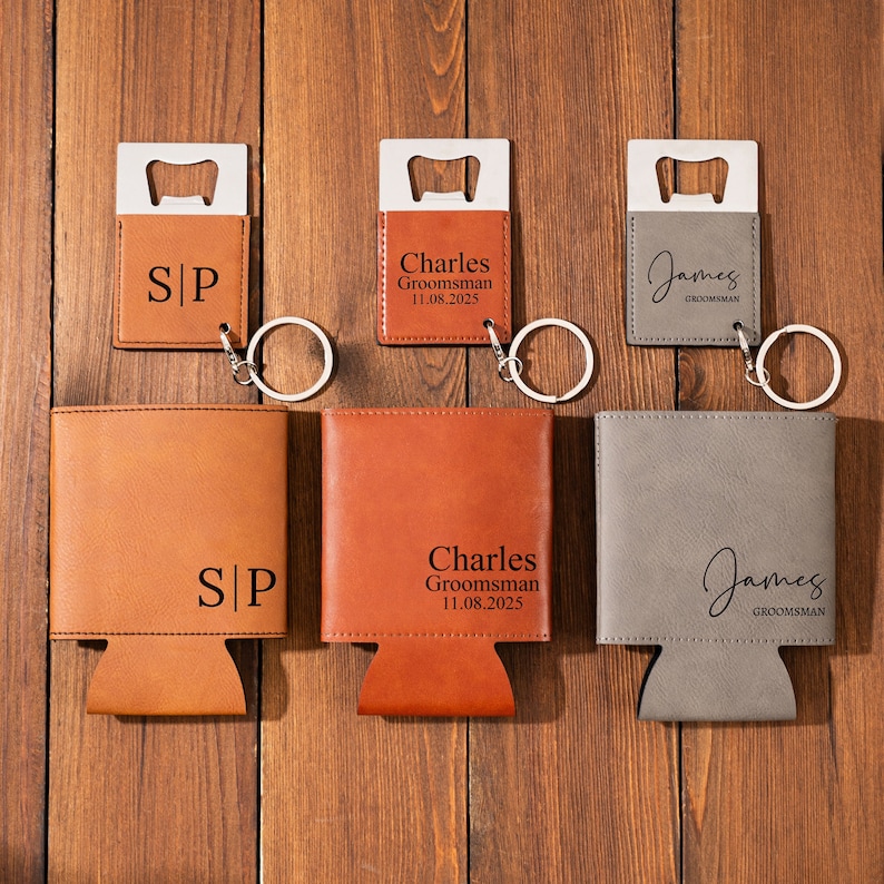May include: Three personalized leather bottle openers with keychains and two brown leather can coolers with the names "Charles" and "James" and the text "Groomsman" engraved on them. One can cooler has the initials "S|P" engraved on it.