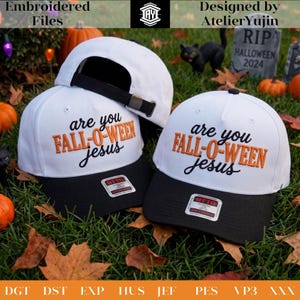 May include: Two white baseball caps with black brims featuring the embroidered text "are you FALL-O-WEEN jesus" in black and orange. Each cap has an adjustable black strap with a metal buckle and a rectangular sticker on the brim labeled OTTO.