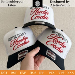 May include: Three white trucker hats with black brims. Each hat features the embroidered phrase "HOTTER THAN A Hoochie Coochie" in red script. The hats have a mesh back and a classic snapback closure.