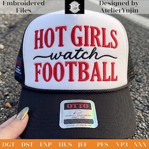 May include: A white and black trucker hat featuring the embroidered red text HOT GIRLS and FOOTBALL with the black cursive text watch in the center. The hat has a black brim, a black mesh back, and a holographic sticker on the brim with OTTO branding.