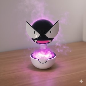 May include: A set of three ceramic mugs with a speckled, matte finish. The mugs are in shades of cream, light gray, and dark gray. Each mug has a simple, minimalist design and a rounded handle.