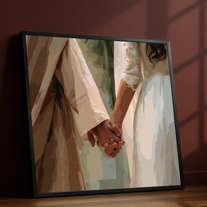May include: Framed art print depicting two people holding hands. The artwork features a warm color palette with beige and white tones. The hands are clasped together, suggesting a bond. The print is set in a black frame.