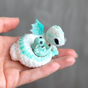 Mommy dragon with baby dragon, glows in the dark. cute dragon figurine, clay dragon sculpture, handmade miniature by Kosse. one of a kind