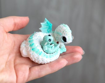 Mommy dragon with baby dragon, glows in the dark. cute dragon figurine, clay dragon sculpture, handmade miniature by Kosse. one of a kind