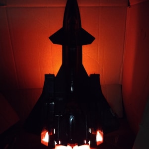 Illuminated! - GI Joe Cobra Night Raven display stand also fits Liberator. Cobra Air logo
