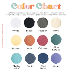 May include: Color chart showing 12 different shirt colors. The colors are: White, Black, Pepper, Ivory, Butter, Yam, Crimson, Blue Spruce, Chalky Mint, Denim, True Navy, and Violet.