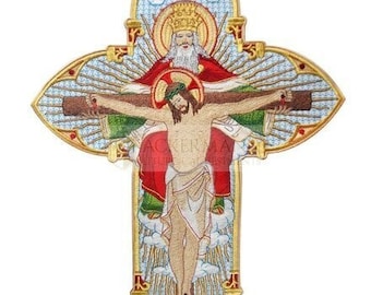 May include: Embroidered cross with a gold frame and a depiction of Jesus Christ on the cross with God the Father above him. The cross is surrounded by a halo of light and clouds.