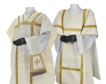 May include: Two white liturgical vestments with gold trim. The vestment on the left has a matching stole with a gold embroidered cross. The vestment on the right has a matching chasuble.